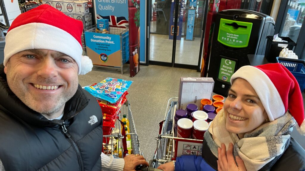 James and Celia shopping for donations for Barrow and Ulverston food banks