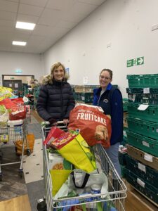 32West team member Claire Sherwen (left) visits the Carlisle foodbank to drop off our donations