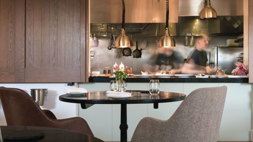 The dining room at Pentonbridge Inn with view of the kitchen pass